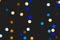 Unfocused multicolored christmas lights with stars shape