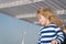 Unforgettable family vacation at sea. Child happy face striped shirt sailor. Child enjoy vacation on cruise ship. Family