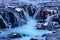 Unfrozen Bruarfoss waterfall in winter. Long exposure shot