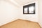 Unfurnished bedroom with beech-colored parquet floors, matching