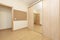 Unfurnished room with large built-in wardrobe and oak parquet floors