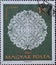 Ungary circa 1960: A post stamp printed in Hungary showing an ornate white halas lace work against an olive background