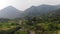 Ungraded Aerial Video Clip of A Rice Paddy Valley with Mountains and River