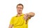 Unhappy annoyed man in yellow T-shirt showing thumbs down gesture isolated on white background