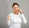 Unhappy annoyed woman argues on phone with fury anger and frustration