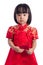 Unhappy Asian Chinese little girl wearing traditional costume