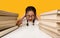 Unhappy Asian Schoolgirl Crying Sitting At Books, Studio Shot