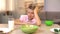 Unhappy boy looking oatmeal with disgust, unappetizing food, healthy breakfast