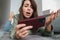 Unhappy caucasian woman playing online game on cellphone