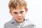 Unhappy conflicted child expressing sadness, anger and disappointment, isolated