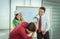 Unhappy Construction team Boss shouting aggressively to his employer in team meeting with zoom in effect