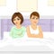 Unhappy couple with arms crossed sitting on bed back to back