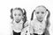 Unhappy cuties. Unhappy little schoolchildren  on white. Adorable small girls with unhappy emotions looking in