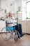 Unhappy disabled senior man sitting in wheelchair