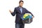 Unhappy elegant guy holding a laundry basket filled with clothes
