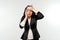 Unhappy, exhausted businesswoman suffering from headache, feeling pain, calming down, standing over white background. Stress