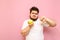 Unhappy fat man eats an apple and looks into the camera with a sad face, showing a dislike gesture. Sad overweight guy with a
