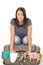 Unhappy Frustrated Attractive Young Woman Sitting on an Overflowed Suitcase