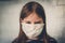 Unhappy little girl in a mask. Portrait of an angry girl dissatisfied with self-isolation and quarantine caused by