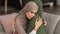 Unhappy Muslim Woman Hugging Depressed Senior Mother At Home, Panorama