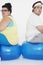 Unhappy Overweight Couple Sitting On Exercise Balls