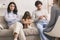 Unhappy Parents And Their Upset Little Daughter Sitting At Psychologist`s Office