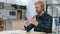 Unhappy Redhead Man with Loss on Smartphone in Cafe