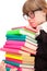 Unhappy school girl with stack color books