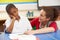 Unhappy Schoolboy Studying In Classroom