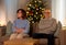 unhappy senior couple at home on christmas