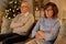 unhappy senior couple at home on christmas