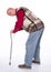 Unhappy senior man with a cane suffering from pain in back or reins over white background