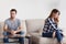 Unhappy stubborn married couple feel angry frustrated sitting on couch