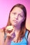 Unhappy teen girl eating tasteless apple