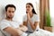 Unhappy Wife Pleading Offended Indifferent Husband For Forgiveness Indoor