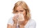 Unhappy woman with paper napkin blowing nose