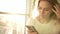 Unhappy woman texting message on mobile. Annoyed woman with smartphone