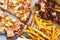 Unhealthy concept. Fast Food - Pizza, Fried Potato. Close up. Popular fast food recipes