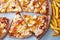 Unhealthy concept. Fast Food - Pizza, Fried Potato. Close up. Popular fast food recipes