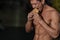 Unhealthy diet concept, athlete eats hamburger