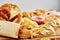 Unhealthy and junk food. Different types of fastfood and snacks on the table with measuring tape