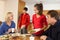 Unhelpful Teenage Clearing Up After Family Meal