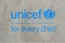Unicef blue logo on brown paper bag, United Nations Childrens Fund is agency responsible for providing humanitarian and