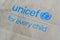 Unicef blue logo on brown paper bag, United Nations Childrens Fund is agency responsible for providing humanitarian and