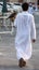 Unidentifiable Arabic man carrying a falcon in Qatar