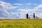 Unidentifiable bikers on the meadow, Czech republic - silhouette