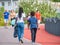 Unidentifiable people and families strolling on a weekend on the promenade of Dambovita lake ( Lacul Morii)