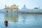 Unidentifiable Punjabi Sikh pilgrim devotee taking bath in front of Golden Temple