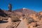 Unidentifiable tourist walking in Teide national park on a sunny day Tenerife, Canary islands, Spain.