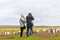 Unidentifiable Tourists taking Pictures at a Gentoo Penguin Colony. Stanley, Falkland Islands.